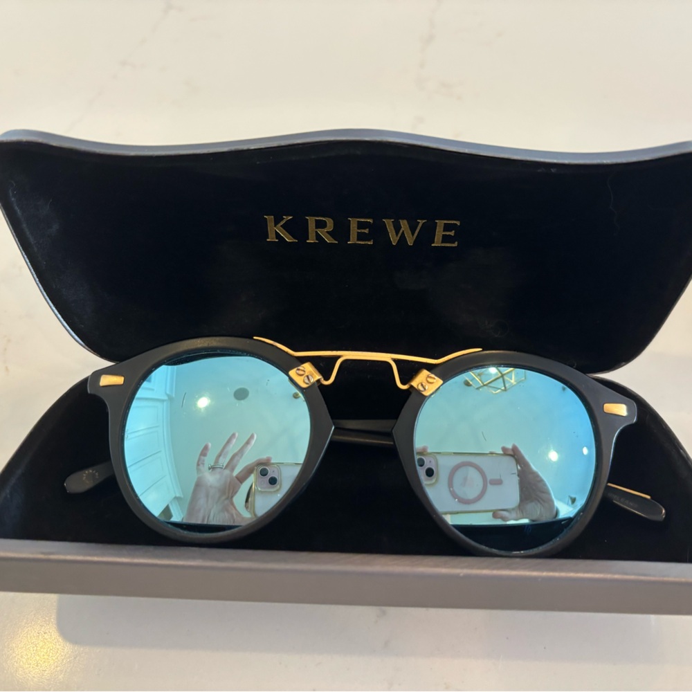 Krewe STL sunglasses in black and gold